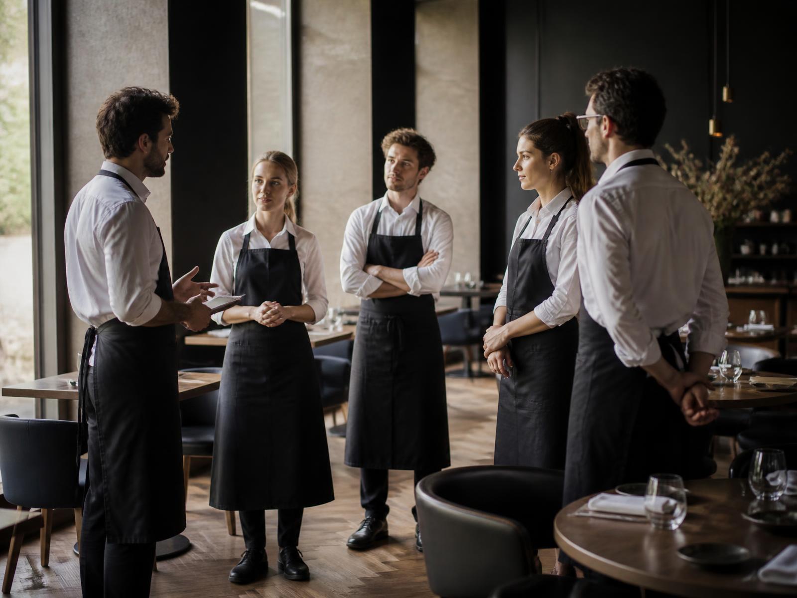A restaurant team working during a busy service